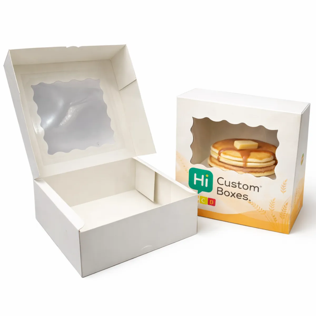 Kraft paper pancake boxes with clear plastic windows displaying fresh pancakes topped with berries and syrup- class=